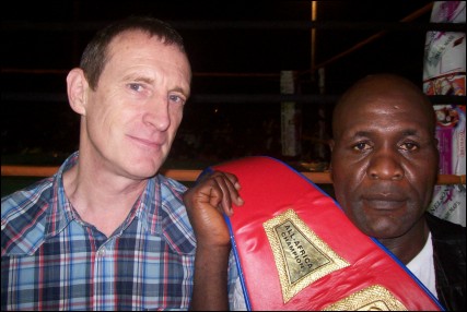CAA Marketing Manager Mr. Yves Musch and UBO All-Africa Heavyweight Champion Matamba Postolo.