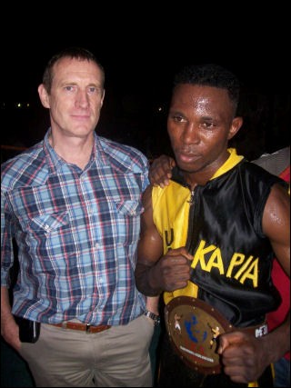 CAA Marketing Manager Mr. Yves Musch with "Young Nelson Champion" Eric Kapia Mukadi.