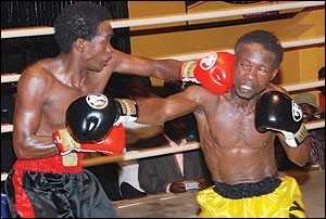 Ntambi (Left) on his way to an eight round decision victory in October over Sonny Kalule.
